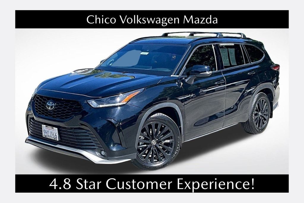 2023 Toyota Highlander XSE in Midnight Black Metallic — front three-quarter view